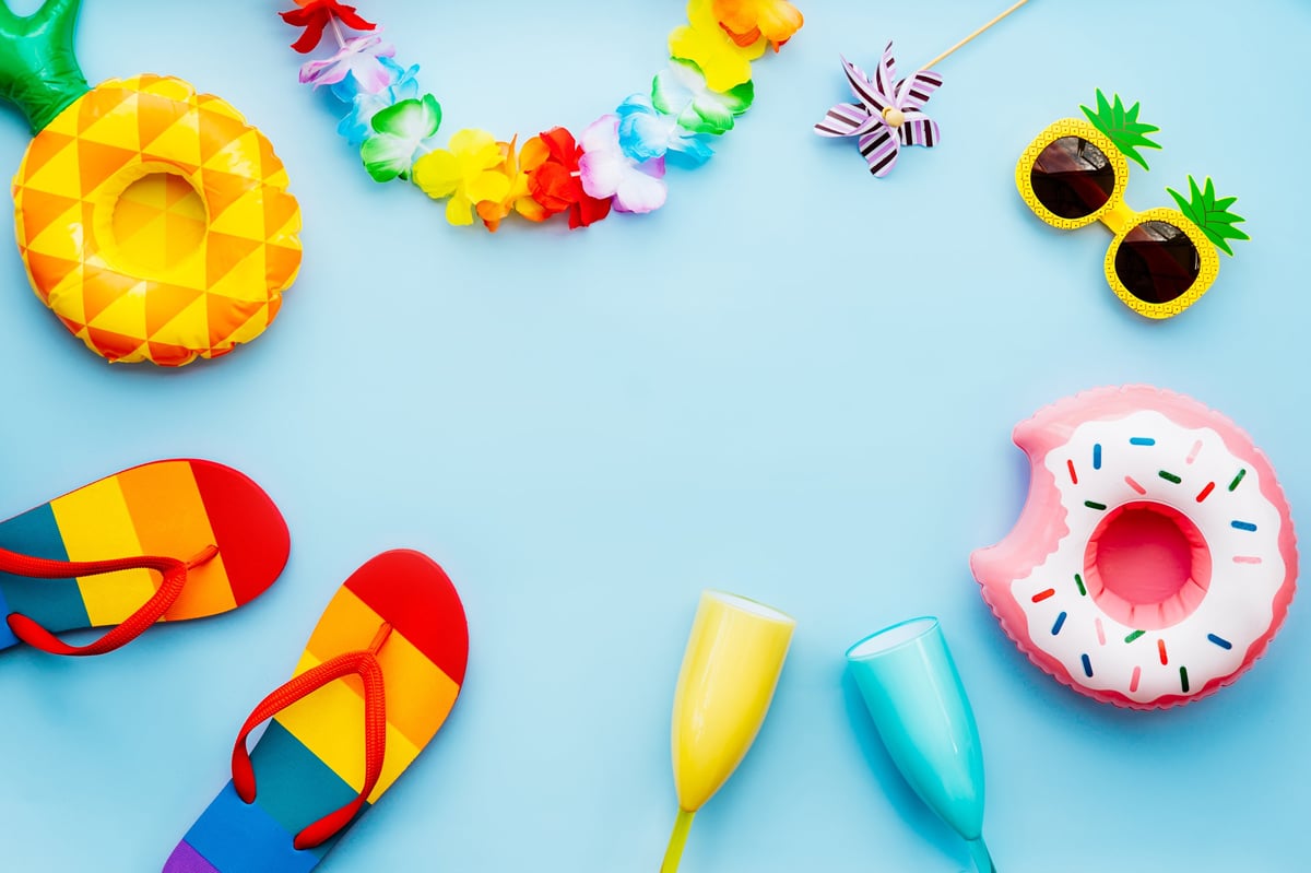 Flat lay of summer vibes concept with colorful pool party items
