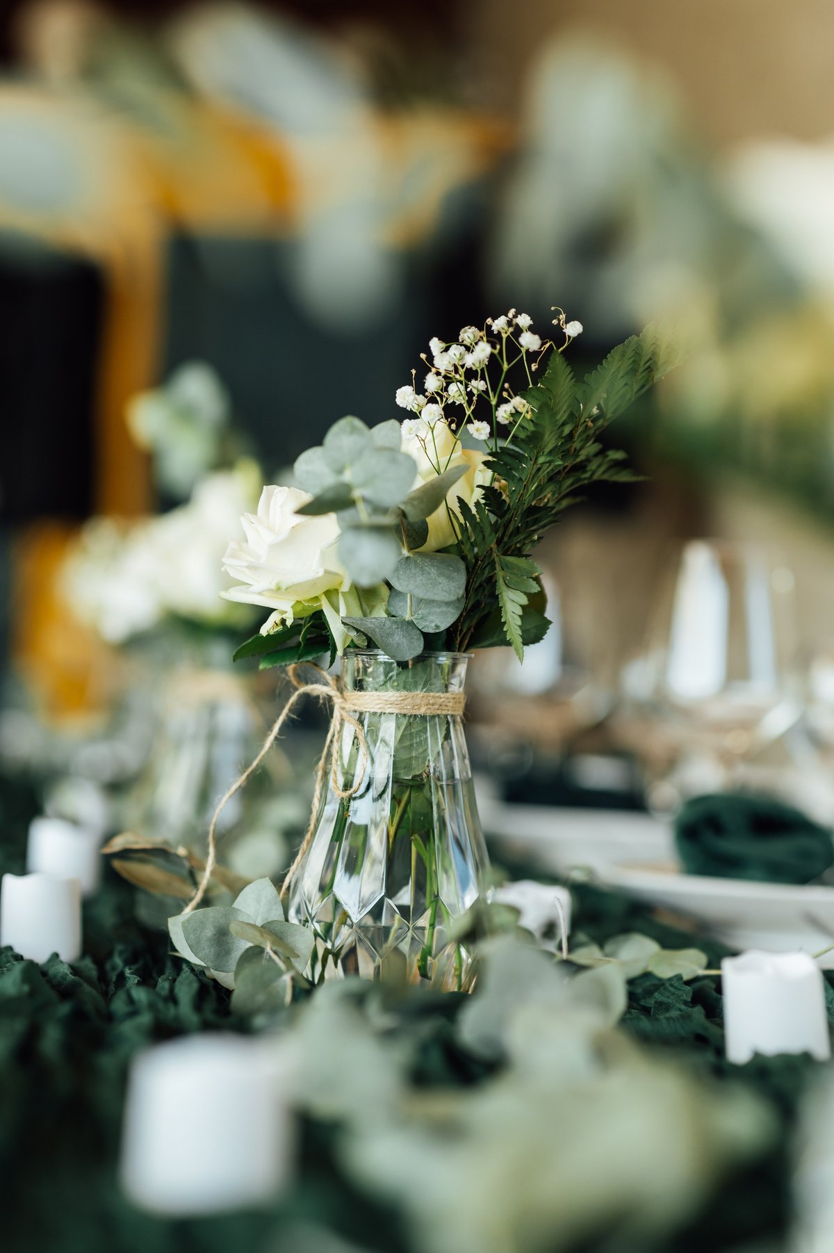 Stylish festive table setting with wine glasses and floral decorations
